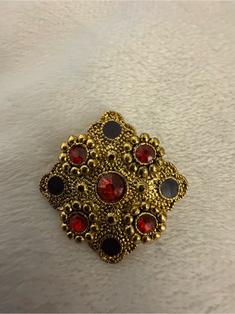 Gold-Tone Brooch with Red Crystal Accents